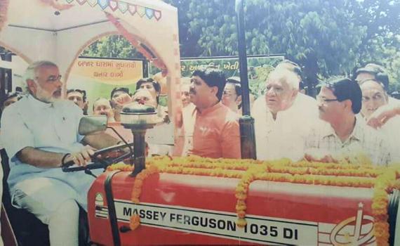 India's 14th Prime Minister Narendra Modi is seen on a MF tractor in an image from during his tenure as Gujarat's Chief Minister